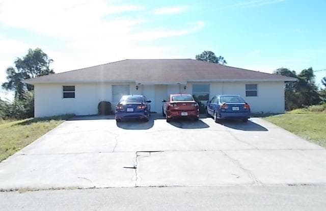 141 Pine LN - 141 Pine Ln, Lehigh Acres, FL 33973