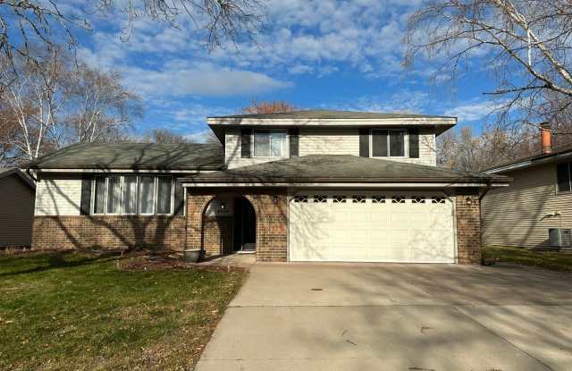 Large Four Level Home, 3 bedrooms, 3 bathrooms with walk-out to backyard - 8824 North Brook Circle, Brooklyn Park, MN 55428