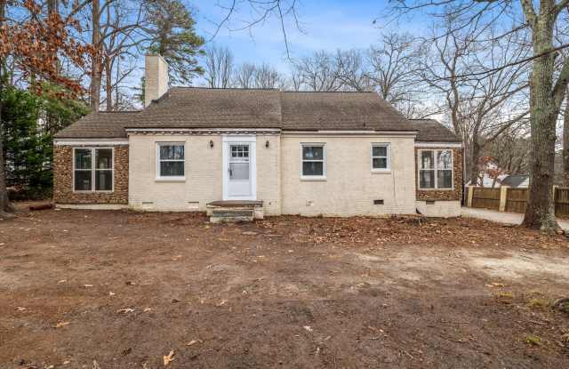 Photo of Brick home, Two Story, Hardwoods, DR, 2 Sun Rooms, FP, Carport!.