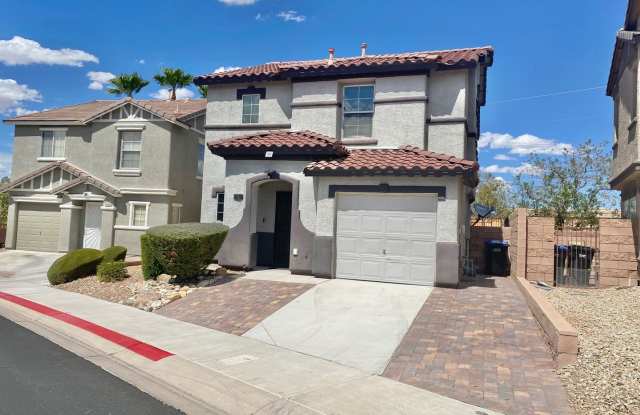 STUNNING 2 STORY HOME 3 BEDROOM 2.5 BATH W/ ONE CAR GARAGE IN A GATED COMMUNITY!
