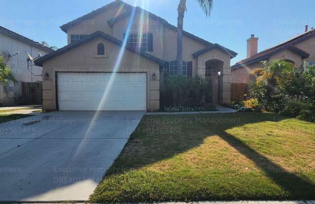 Photo of 2 story home with 4 bedrooms, 2.5 bathrooms, and a pool.