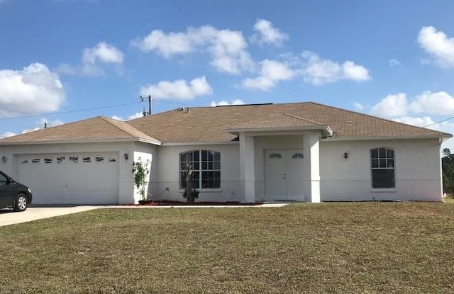 146 Grant BLVD - 146 Grant Boulevard, Lehigh Acres, FL 33974