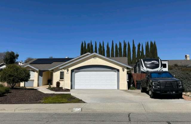 4 bedroom 2 bath home with bonus room close to schools and shopping. Rv and or boat parking.