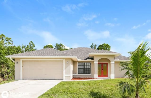 717 Little Rock Street East - 717 Little Rock Street East, Lehigh Acres, FL 33974