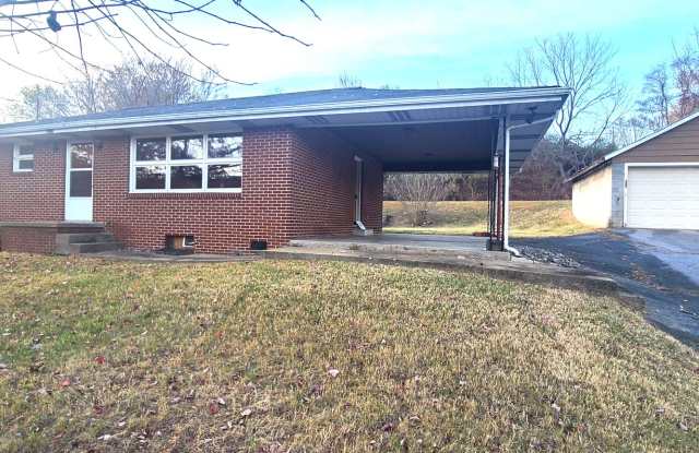 Photo of HALF OFF FIRST MONTH RENT! Single family brick home with full unfinished bsmt  detached garage