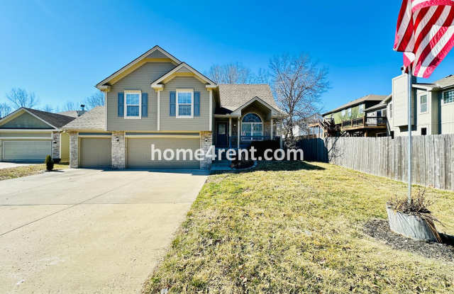 Spacious Four Bedroom Northland Home with a Finished Basement, 3 car garage and Fenced Yard!