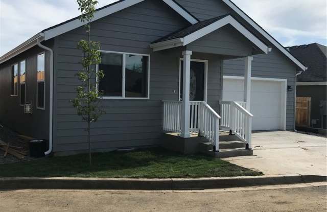 3-Bedroom Home with Garage and Fenced Yard in Prime Location