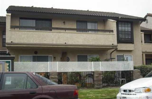 Charming Gated 2 bedroom and 1.5 Bath Condo with a Two-Car Garage