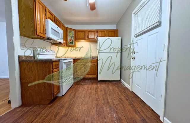 CHARMING HOME WITH GARAGE, LARGE BASEMENT, AND OVERSIZED UPSTAIRS BEDROOM