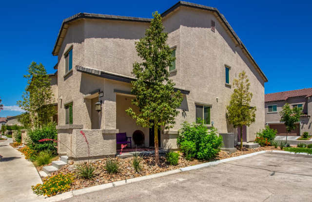 Beautiful corner lot townhome with custom paint, plentiful community green spaces.