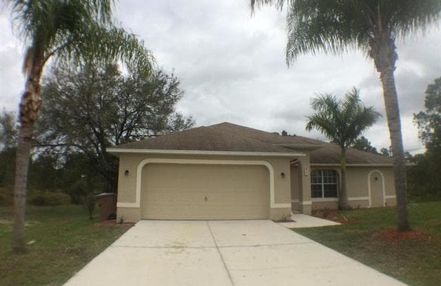 519 Millcreek ST - 519 Millcreek Street, Lehigh Acres, FL 33974