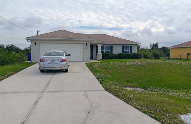 310 Patio Street - 310 Patio Street, Lehigh Acres, FL 33974