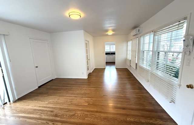 Bungalow - 1 bedroom + Office = natural wood floors, mini split a/c , new appliances, private patio, 1 parking space with EV charger
