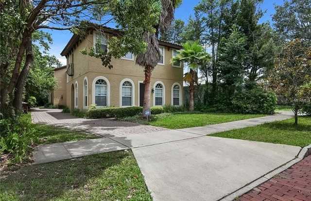 Beautiful DUPLEX loaded with custom upgrades on brick paved street in Downtown Orlando.