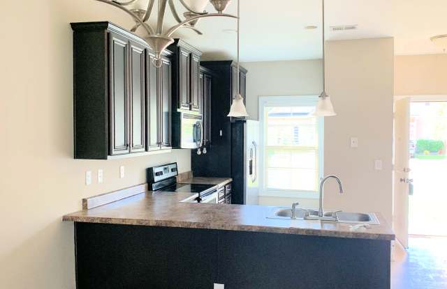 One Level End Unit Townhome with 1 Car Garage