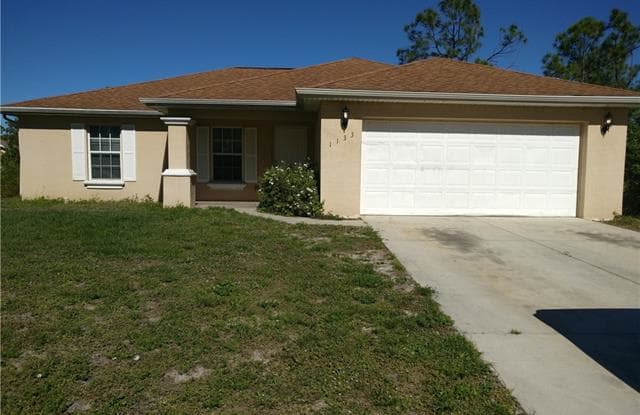 1133 Crocus ST - 1133 Crocus St E, Lehigh Acres, FL 33974