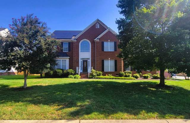 Stately brick front contemporary on huge corner lot.