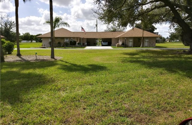 207 OAKLAWN CT - 207 Oaklawn Court, Lehigh Acres, FL 33936