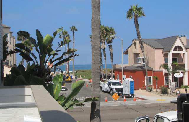 Condo with 2 car garage across from the beach