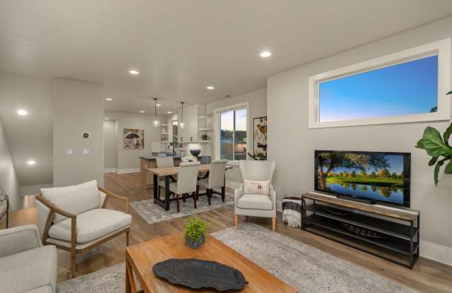 BRAND NEW, END UNIT/FORMER MODEL HOME with ALL the Upgrades - Dual Primary Bedrooms, 3rd Bedroom and Additional Lower Level Office Space!