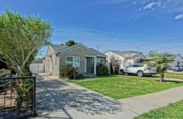 REMODELED, CHARMING & AIRY 3BR2BA HOME W/ OFFICE ON A LARGE LOT W/ NICELY LANDSCAPED FRONT YARD, LARGE FENCED REAR YARD W/ DECK & LARGE 3-CAR DRIVEWAY NEXT TO SCHOOL, PARK, SHOPPING, FREEWAY ACCESS & 10 MINS TO BEACH!