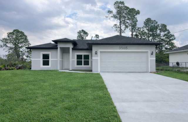 BRAND NEW CONSTRUCTION! GORGEOUS 4 BD/ 2BA HOME IN LEHIGH ACRES