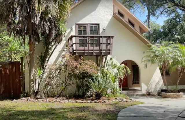 4/2.5 (Buckingham South) This Spanish-style home is a hidden gem, nestled away off of Newberry Rd, offering convenience and privacy all in one. photos photos