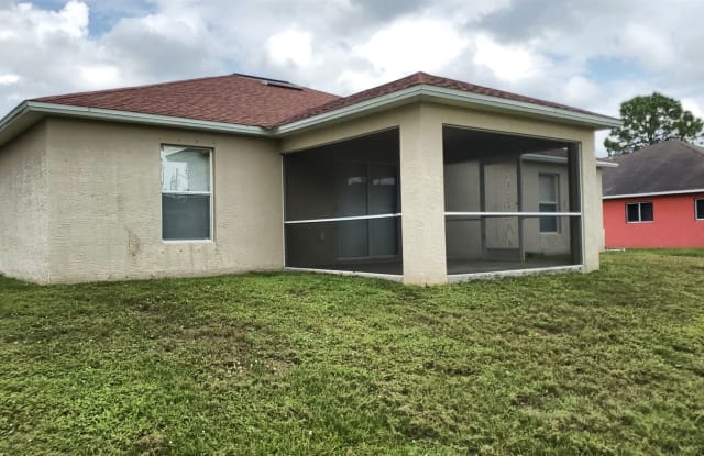 832 Palomino St E - 832 Palomino Street East, Lehigh Acres, FL 33974