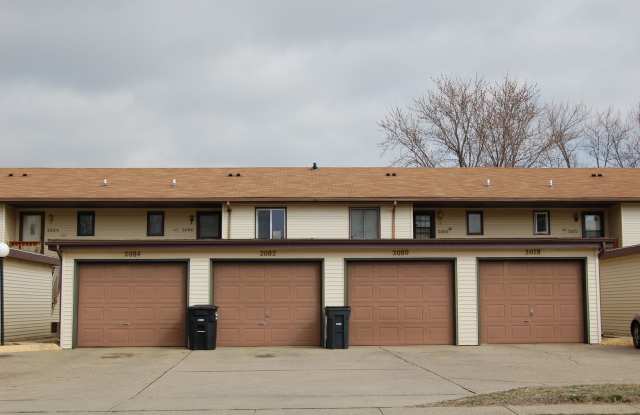 Ground-level condo featuring 2 bedrooms and 1 full bathroom, along with a detached garage.