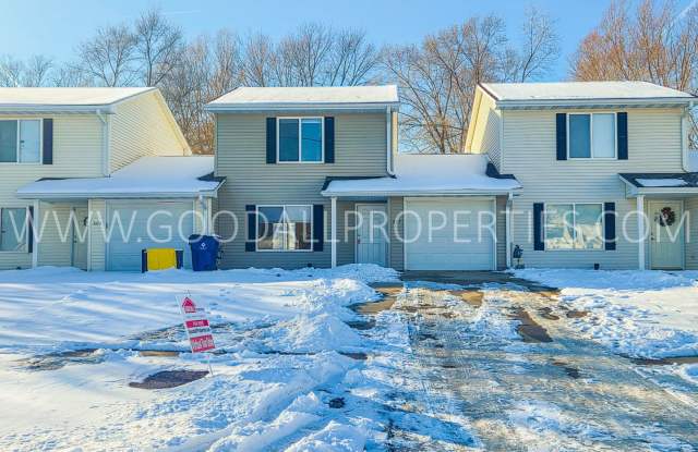 Photo of Check out this 3-bedroom, 1.5-bath townhome in Van Meter, complete with an attached garage.