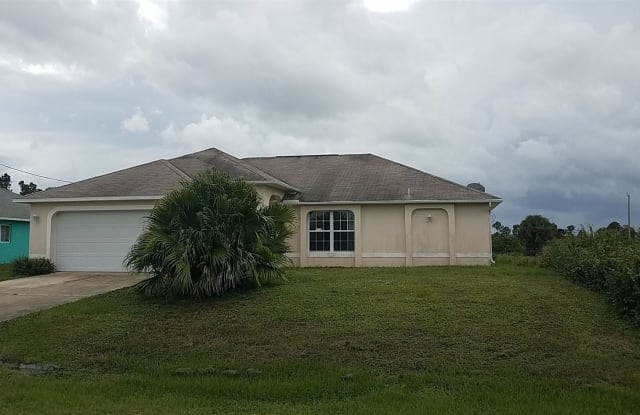 742 Cane St E - 742 Cane Street, Lehigh Acres, FL 33974