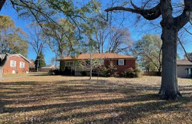 Adorable 3-bed 2-bath brick ranch, sitting on nearly a half acre lot, is located in Gastonia