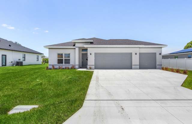 Brand-New Cape Coral Home with 3-Car Garage & Luxury Upgrades!