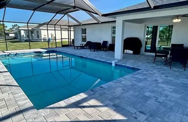Modern Cape Coral Living: 4-Bedroom Home with Private Heated Pool photos photos