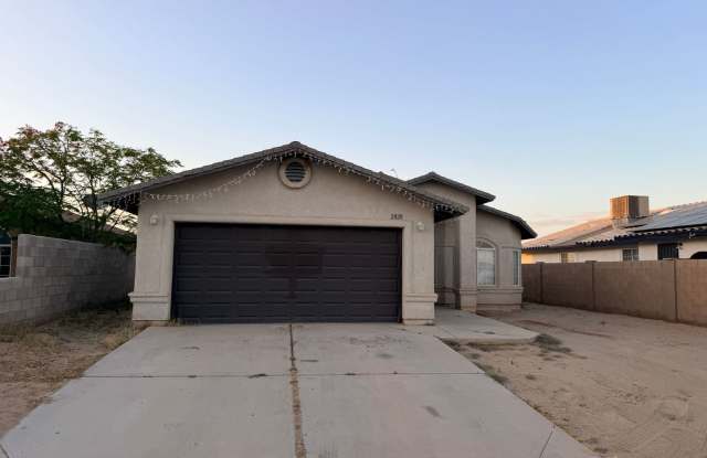 Three Bedroom Home with Two Car Garage and Fenced Lot in San Luis AZ.