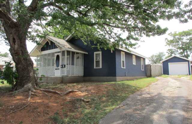 Cute Bungalow with a screened in front porch