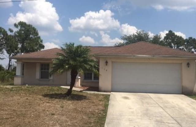 389 Chamonix AVE S - 389 Chamonix Avenue South, Lehigh Acres, FL 33974