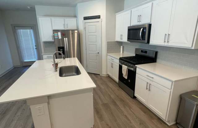 3 bed 2 bath home with attached garage and fenced in backyard built in 2023