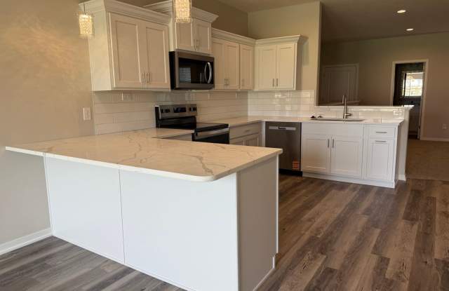 Ranch townhome with 2 stall garage. Spacious 2 bedrooms with walk in closets, 2.5 bathroom, 1st floor laundry