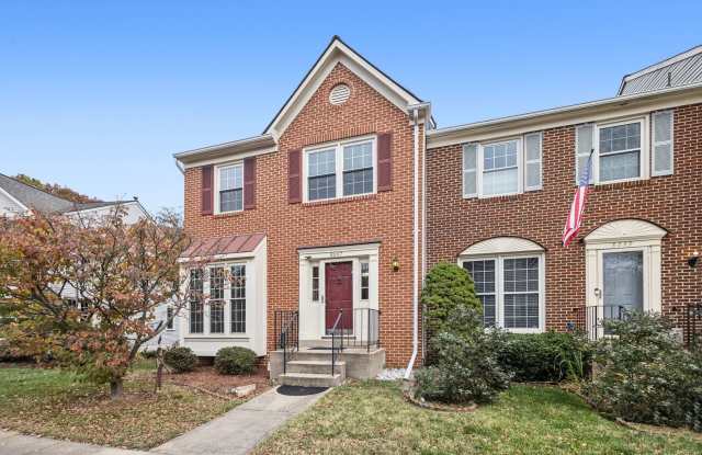Modern Brick End-Unit Townhome with Stunning Upgrades and Serene Wooded Views