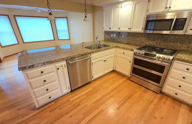 Photo of 4bd/3ba HUGE Home w/Hardwood Floors, Russian Fireplace, 2-Car Garage  Fenced Back Yard!