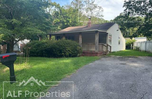 Charming 2-Bedroom Home with Bonus Sunroom, Covered Patio & Fenced Backyard
