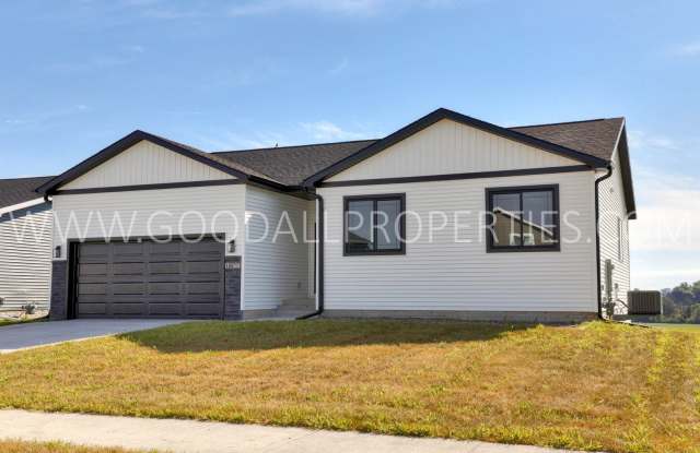 Stunning ranch-style home in Altoona featuring 4 bedrooms and 3 bathrooms, with a finished walk-out basement.