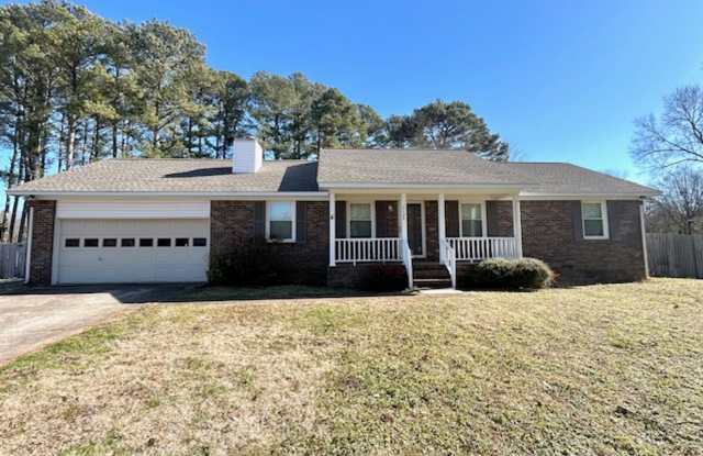 SPACIOUS 3/2 IN COUNTRY SETTING WITH LARGE DECK AND LARGE FENCED IN BACK YARD.