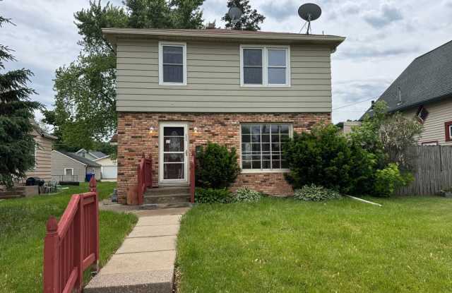 Charming 3 Bedroom Home With Fireplace and 2-Car Garage in Moline!