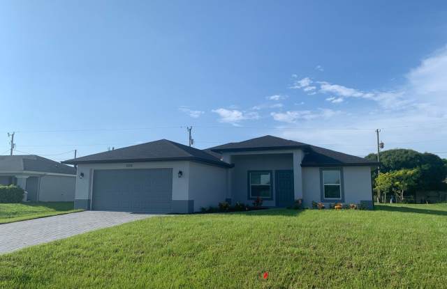 Photo of LIKE BRAND NEW 3 Bed, 2 Bath Home with 2-Car Garage, Fenced Yard  Screened Lanai!
