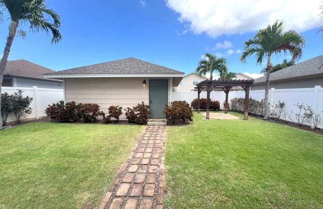 4 bedroom 2.5 Bath house in Ocean Pointe with 2 car garage, fenced yard and PV solar panels