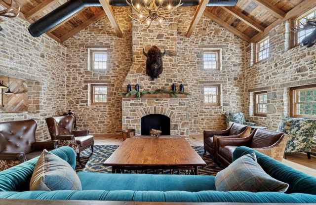 Timeless Stone Farmhouse Estate with Pool, Gardens & Grand Barn Living in Chester Springs