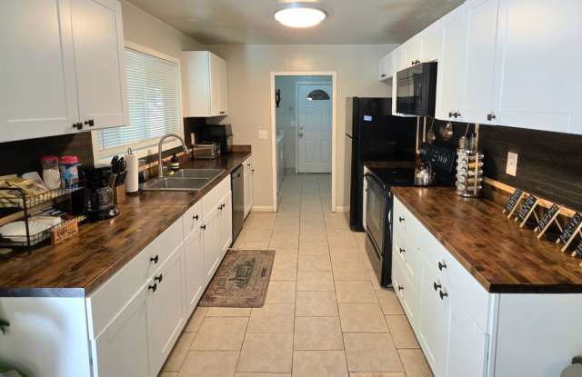 Photo of FURNISHED OR UNFURNISHED 5 BEDROOM 3 BATH HOME WITH 3 CAR GARAGE