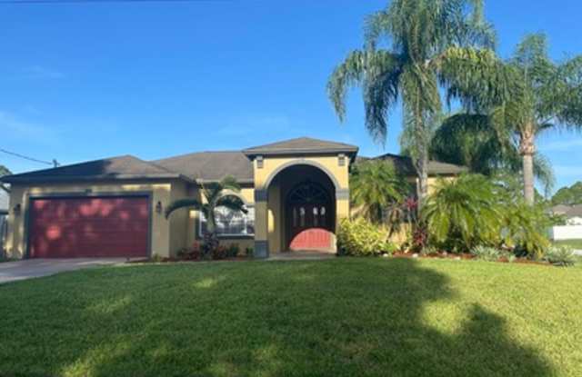 Well maintained large 4/2/2 corner lot pool home on a canal